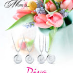 A Mother's Day display with four silver pendant necklaces that spell out LOVE when next to each other